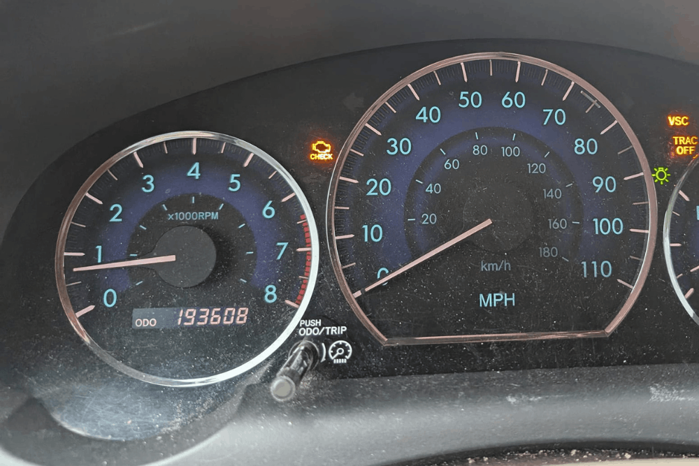 Check engine light, auto repair in Summerville, SC at SBS Automotive Maintenance and Repair. Image of a dashboard with the check engine, VSC, and TRAC OFF warning lights illuminated.